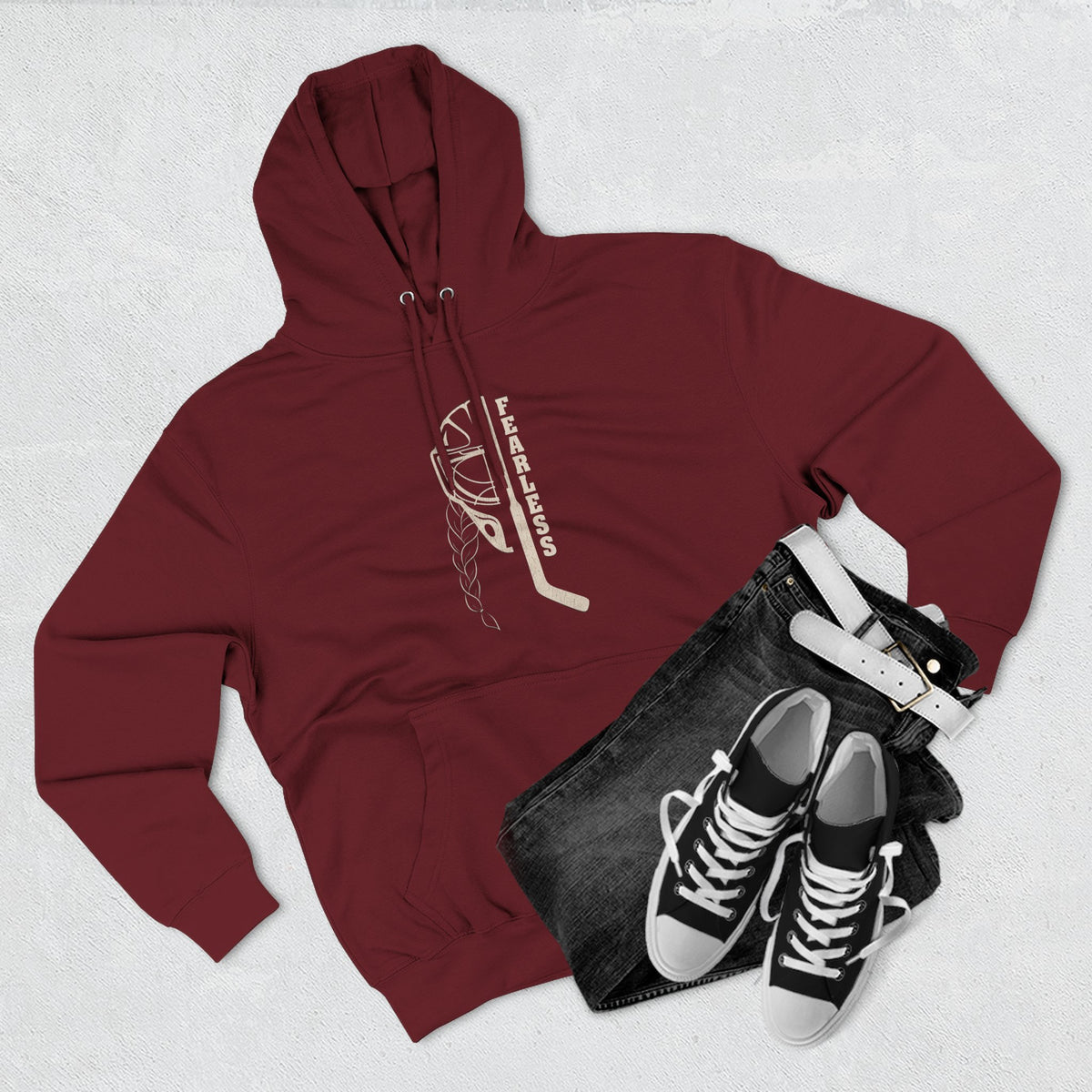 Fearless goalie hockey hoodie in Burgundy - styled flat lay with jeans