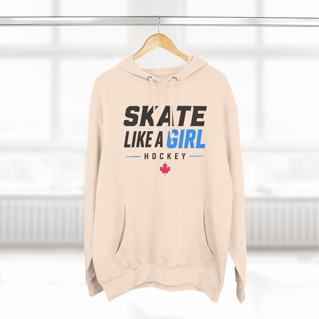Skate Like A Girl Hockey hoodie in Pale Pink hanging on a rack