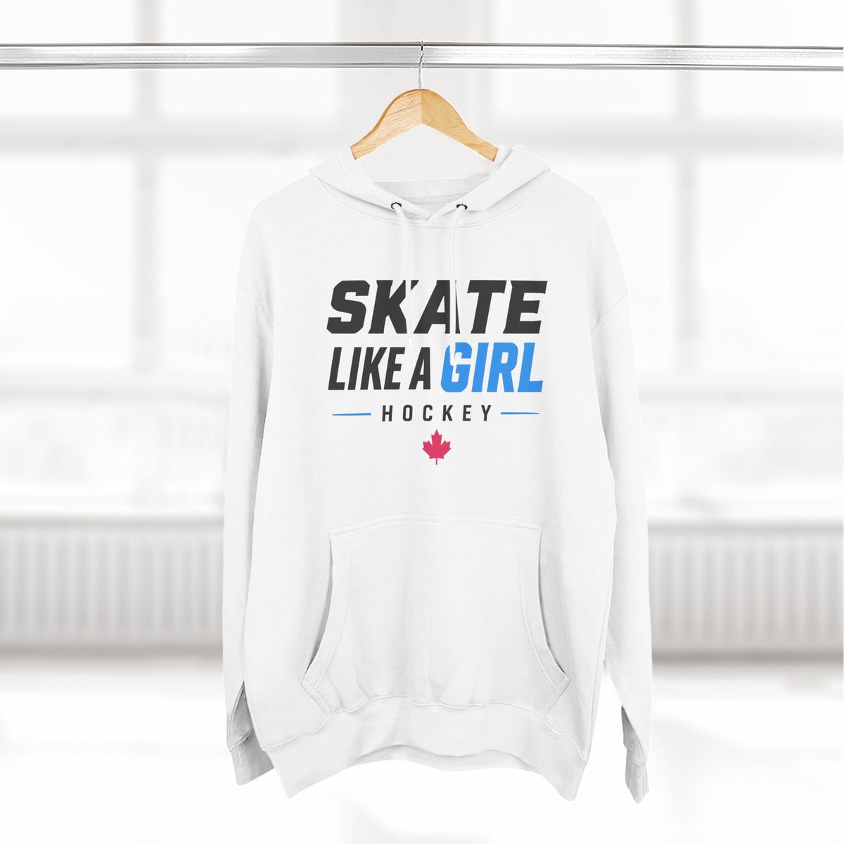Skate Like A Girl Hockey hoodie in White hanging on a rack