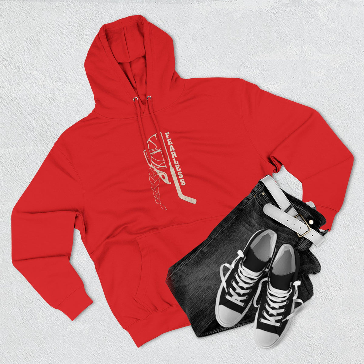 Fearless goalie hockey hoodie in Red - styled flat lay with jeans