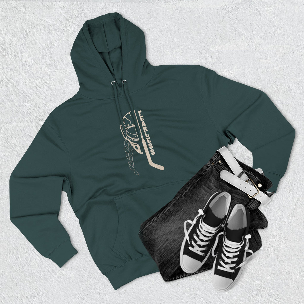 Fearless goalie hockey hoodie in Sports Green - styled flat lay with jeans
