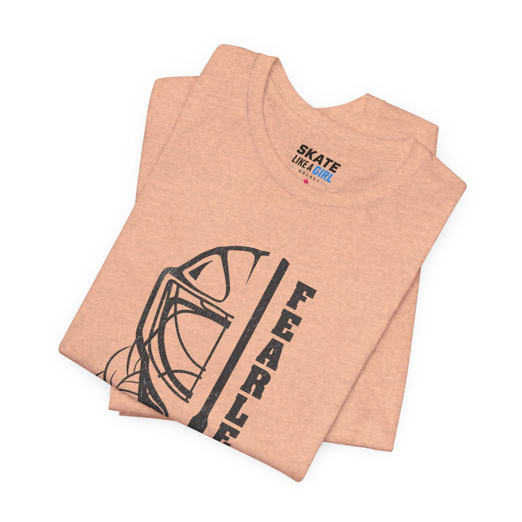 Skate Like A Girl Fearless Goalie hockey tee in Heather Peach - folded
