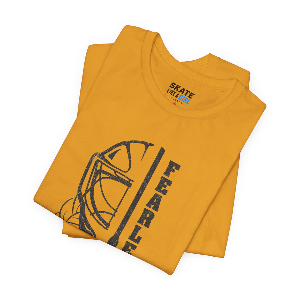 Skate Like A Girl Fearless Goalie hockey tee in Mustard - folded
