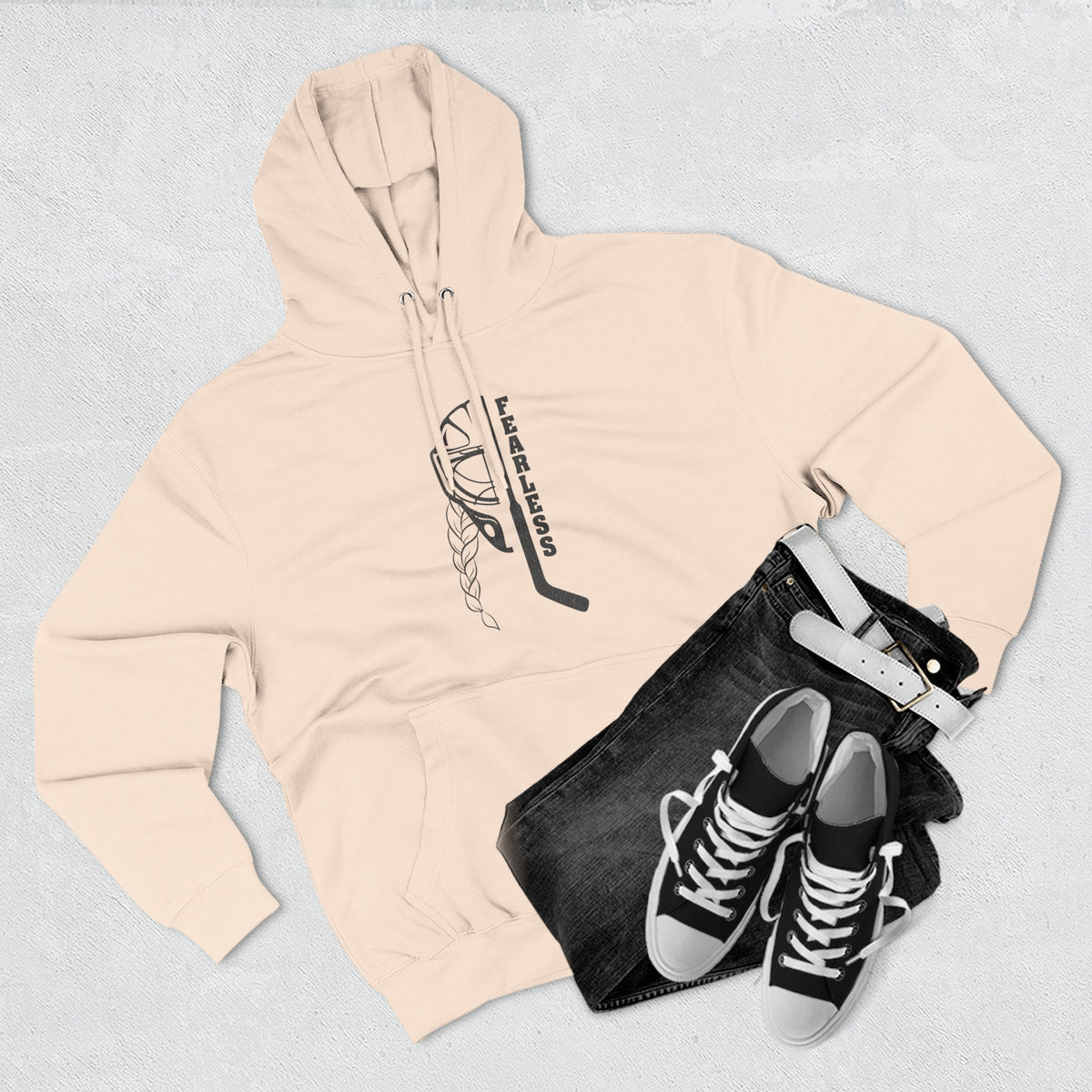 Fearless goalie hockey hoodie in Pale Pink - styled flat lay with jeans