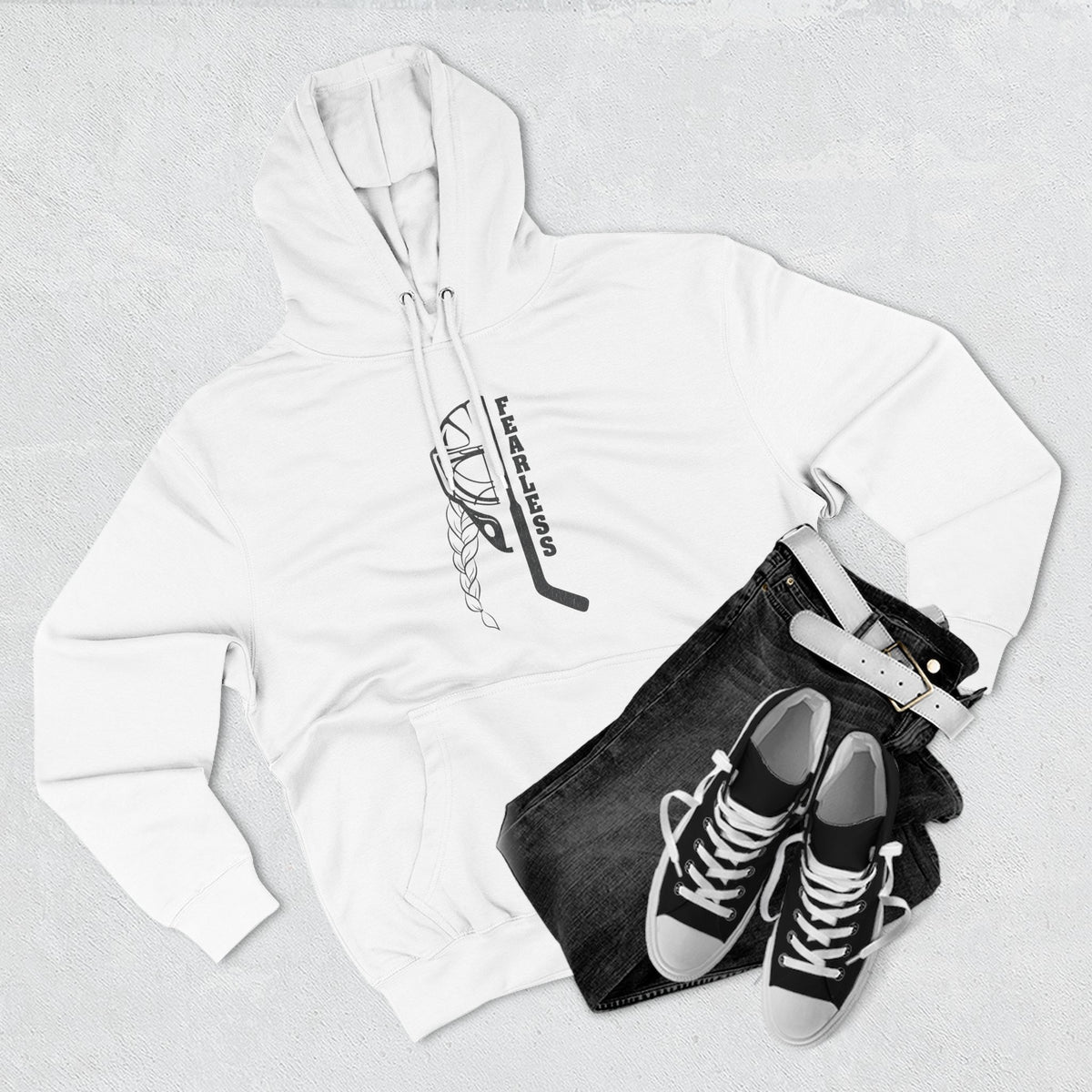 Fearless goalie hockey hoodie in White - styled flat lay with jeans